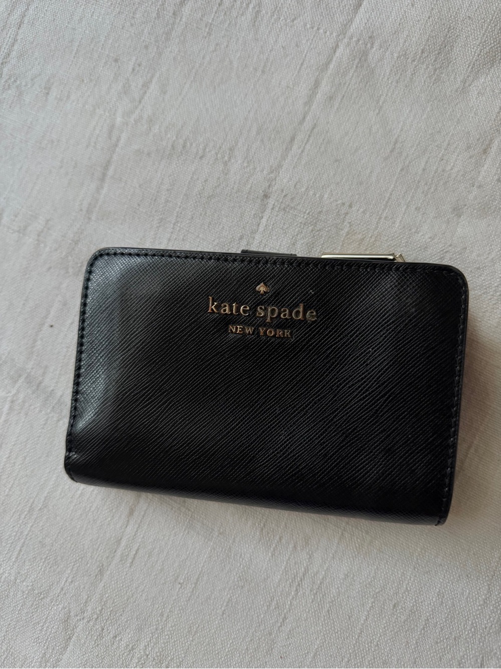 kate spade black leather compact wallet with gold logo